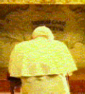 Pope kneels in prayer at the Grotto of the Annunciation