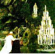 The Holy Father kneels in reverence at the Shrine of Lourdes